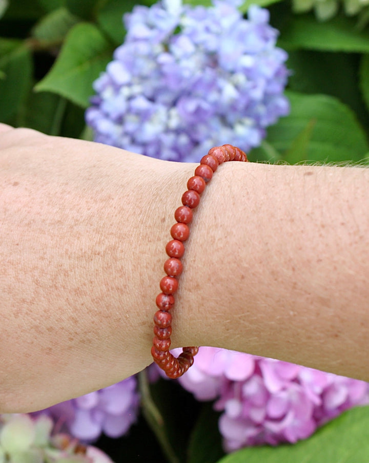 Red Jasper 4mm Beaded Gemstone Bracelet on a wrist