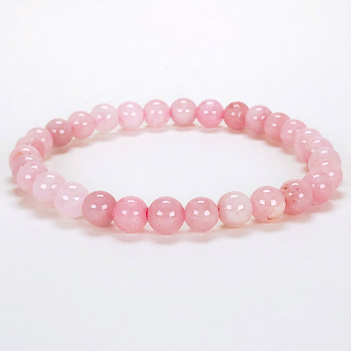 Rose Quartz 6mm Beaded Gemstone Bracelet on a white background.