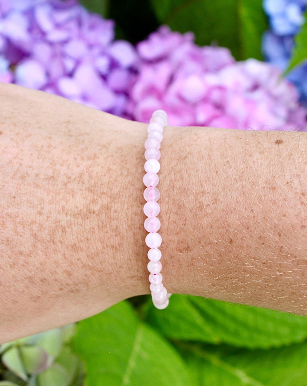 Rose Quartz 4mm Beaded Gemstone Bracelet on a wrist