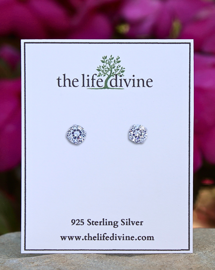 Round CZ Silver Stud Earrings on a card.