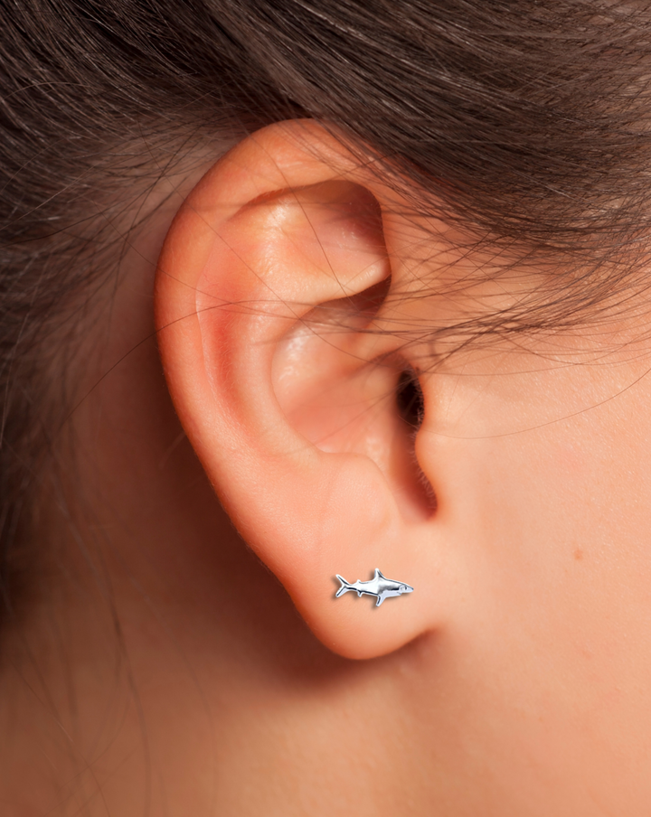 Shark Sterling Silver Earring on an ear.