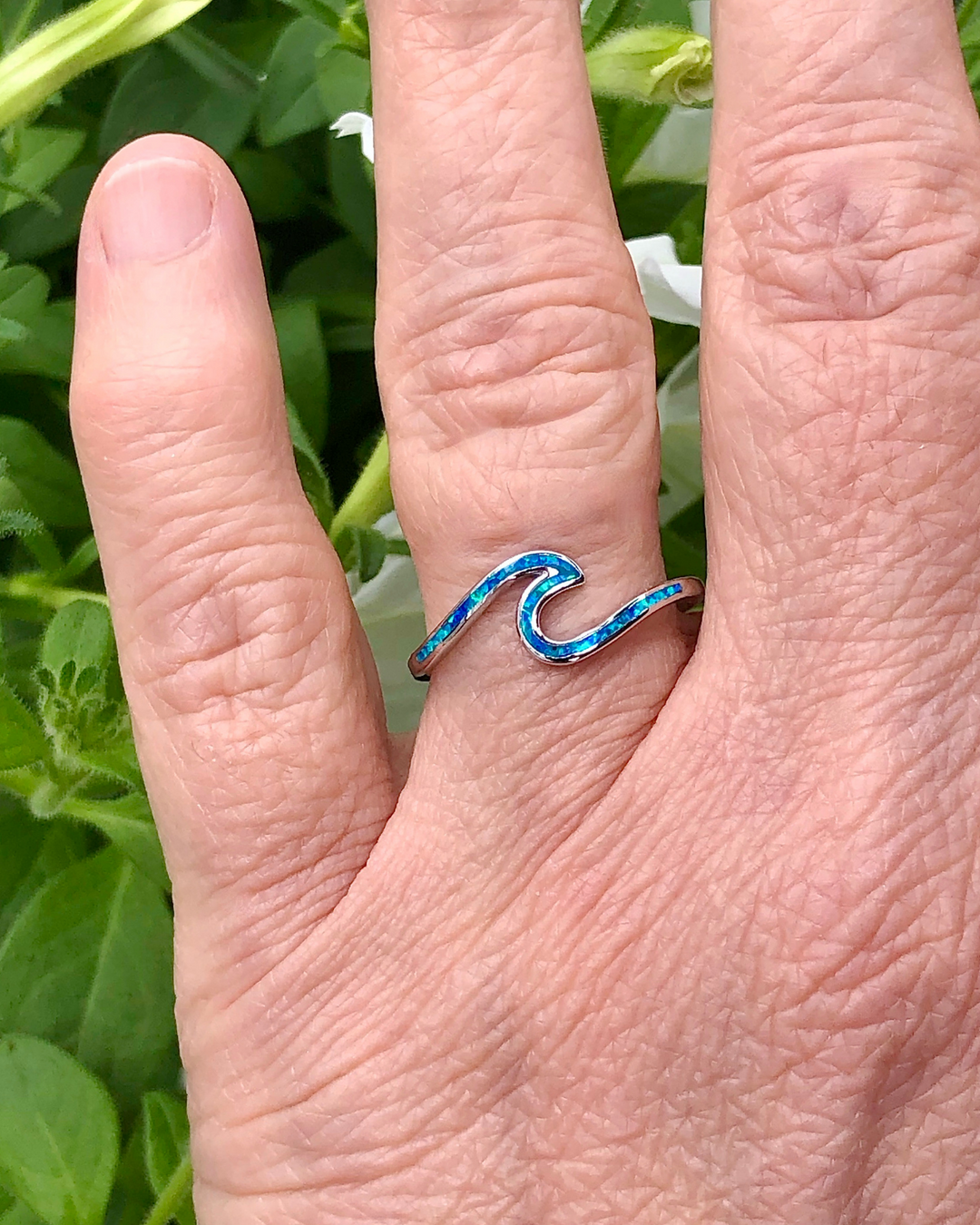 Silver Wave Ring with Blue Lab Opal on selenite on finger