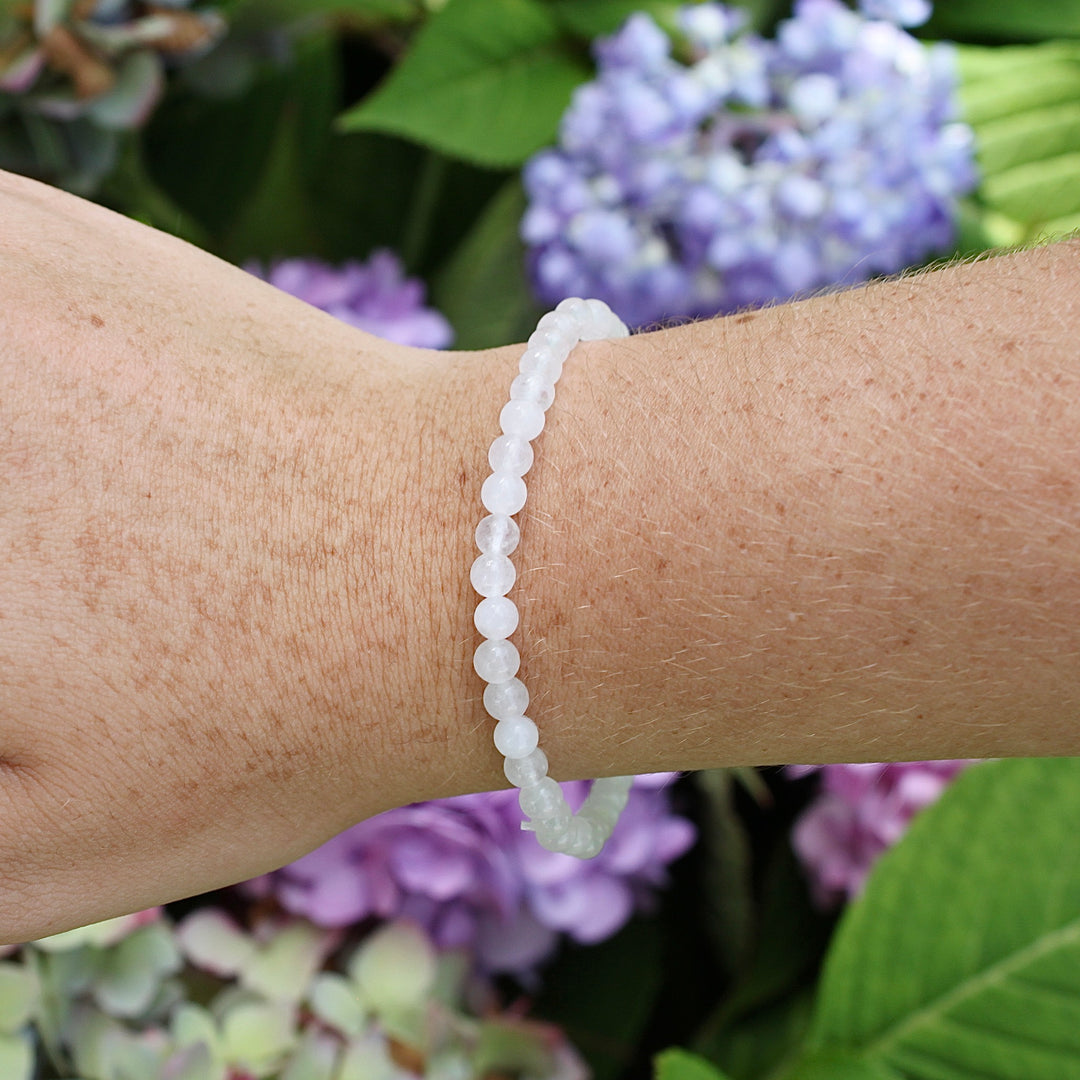 Snow Quartz 4mm Beaded Gemstone Bracelet on a wrist