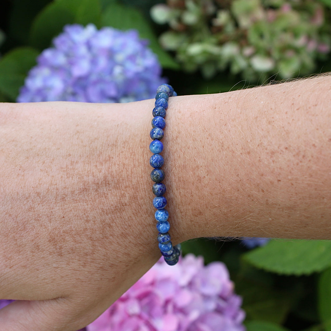 Sodalite 4mm Beaded Gemstone Bracelet on a wrist.