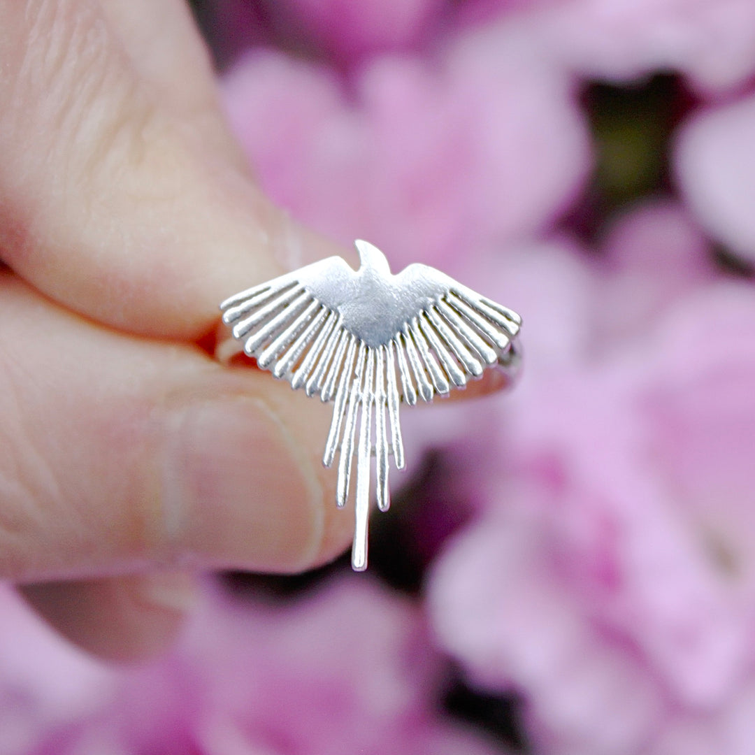 Sterling Silver Pheonix Ring held between fingers