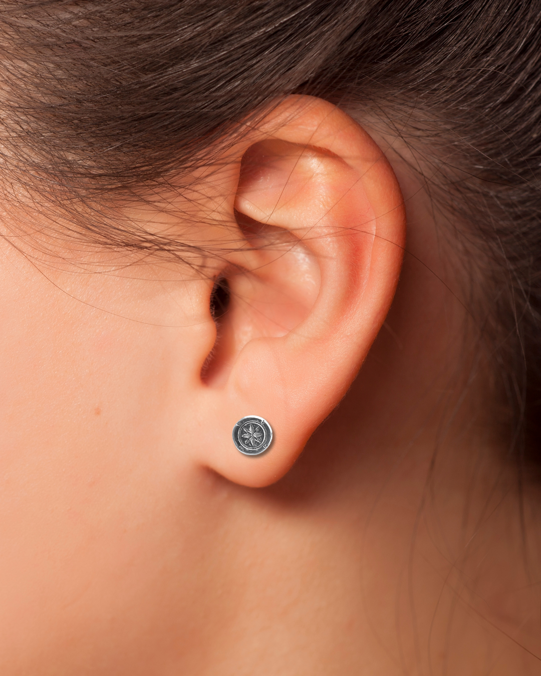 Sterling Silver Compass Stud Earrings on ear