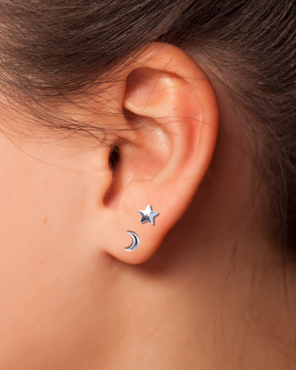 Sterling Silver Crescent Moon and Star Stud Earrings on ear