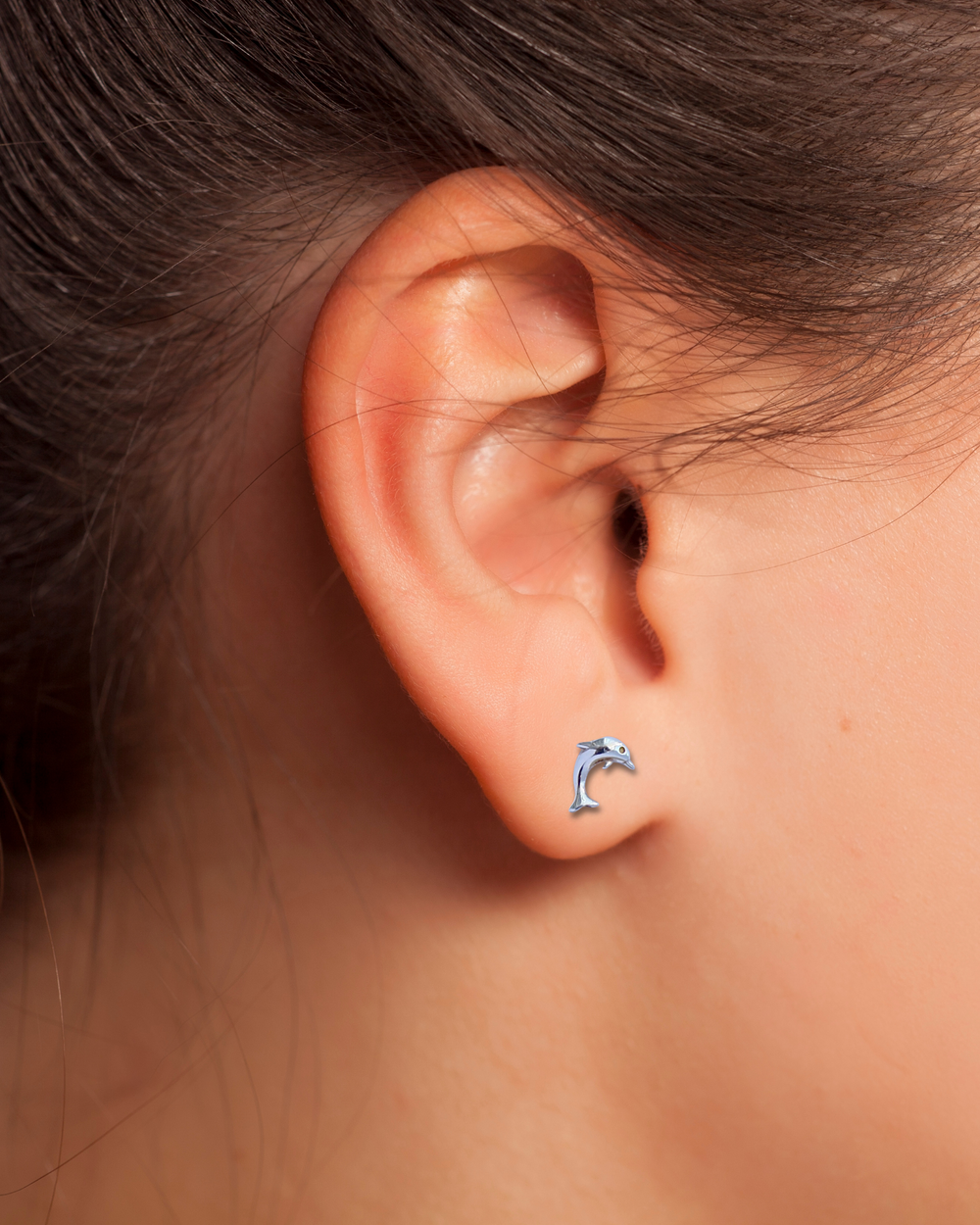 Sterling Silver Dolphin Stud Earrings on ear