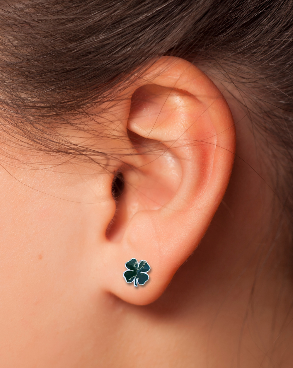 Sterling Silver Green Four Leaf Clover Earrings on ear
