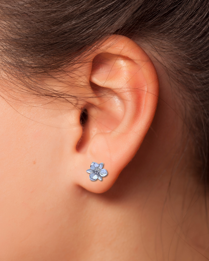 Sterling Silver Plumeria Stud Earrings on ear