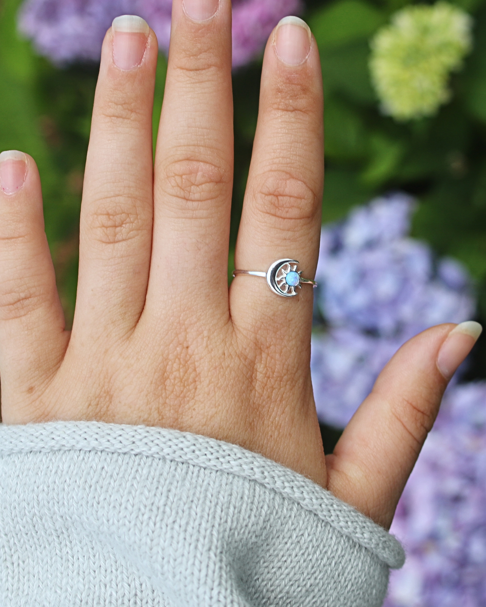 Sterling Silver Sun and Moon Blue Lab Opal Ring on finger