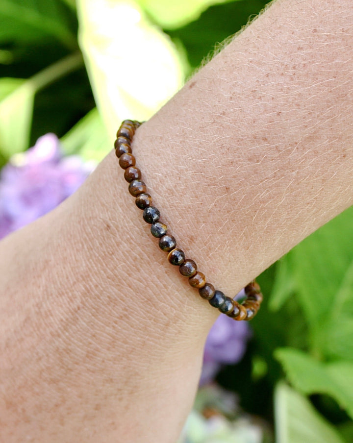 Tiger Eye 4mm Beaded Gemstone Bracelet on a wrist