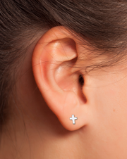 Sterling Silver Cross Earring on a Women's Ear