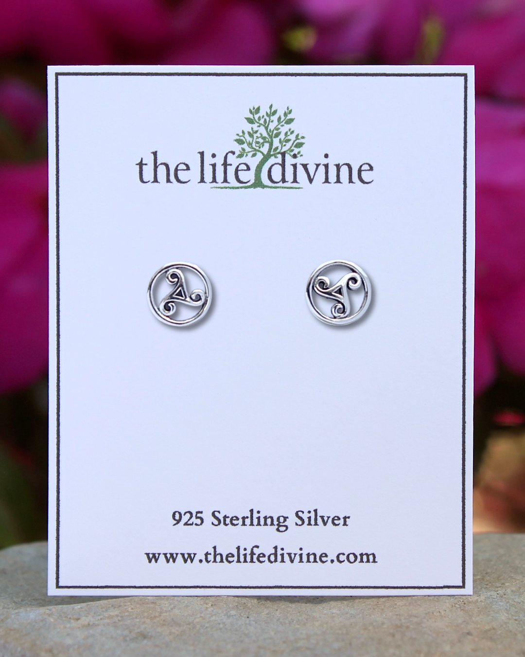 Triskelion Sterling Silver Earrings on a card.