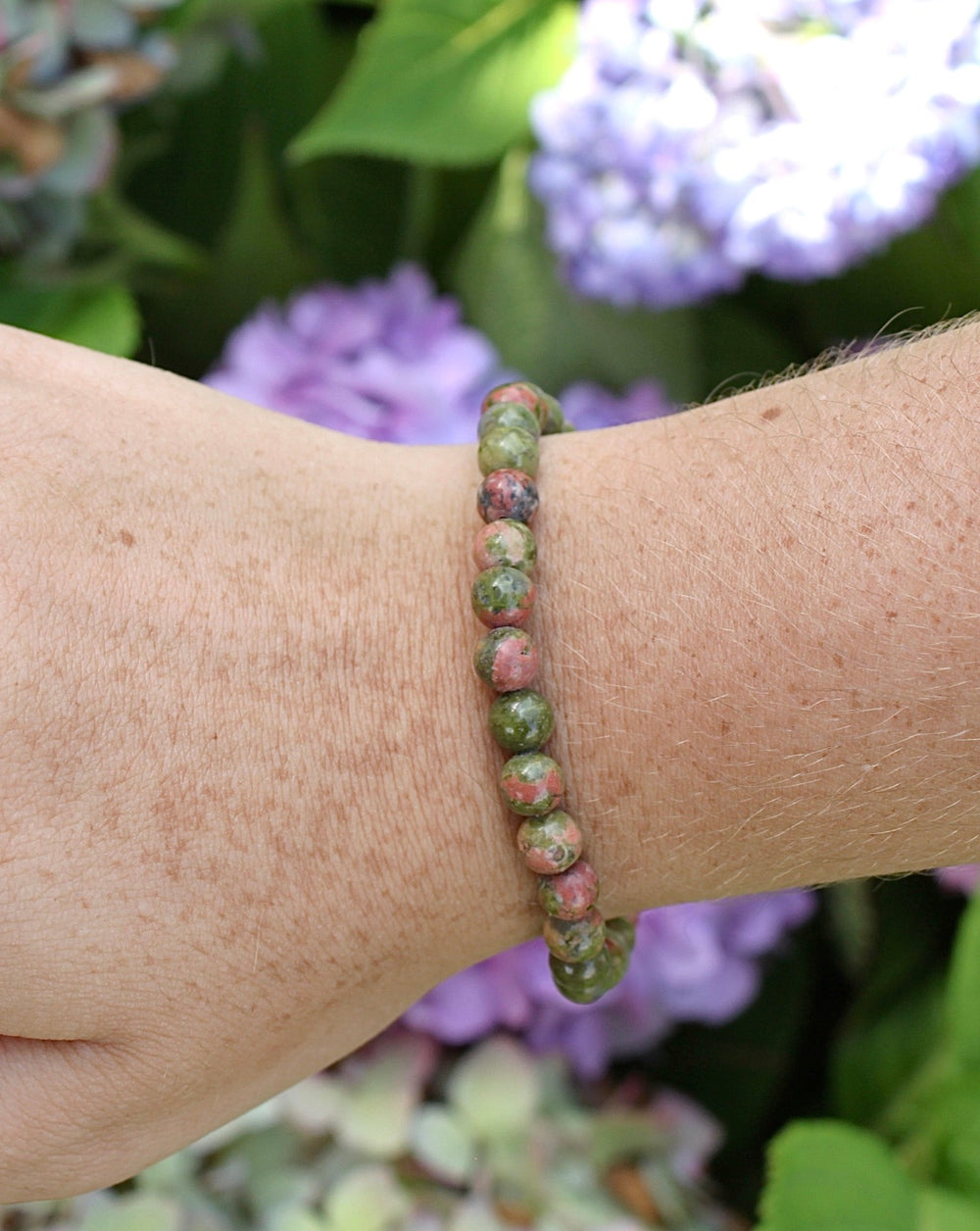 Unakite 6mm Beaded Gemstone Bracelet on a wris.