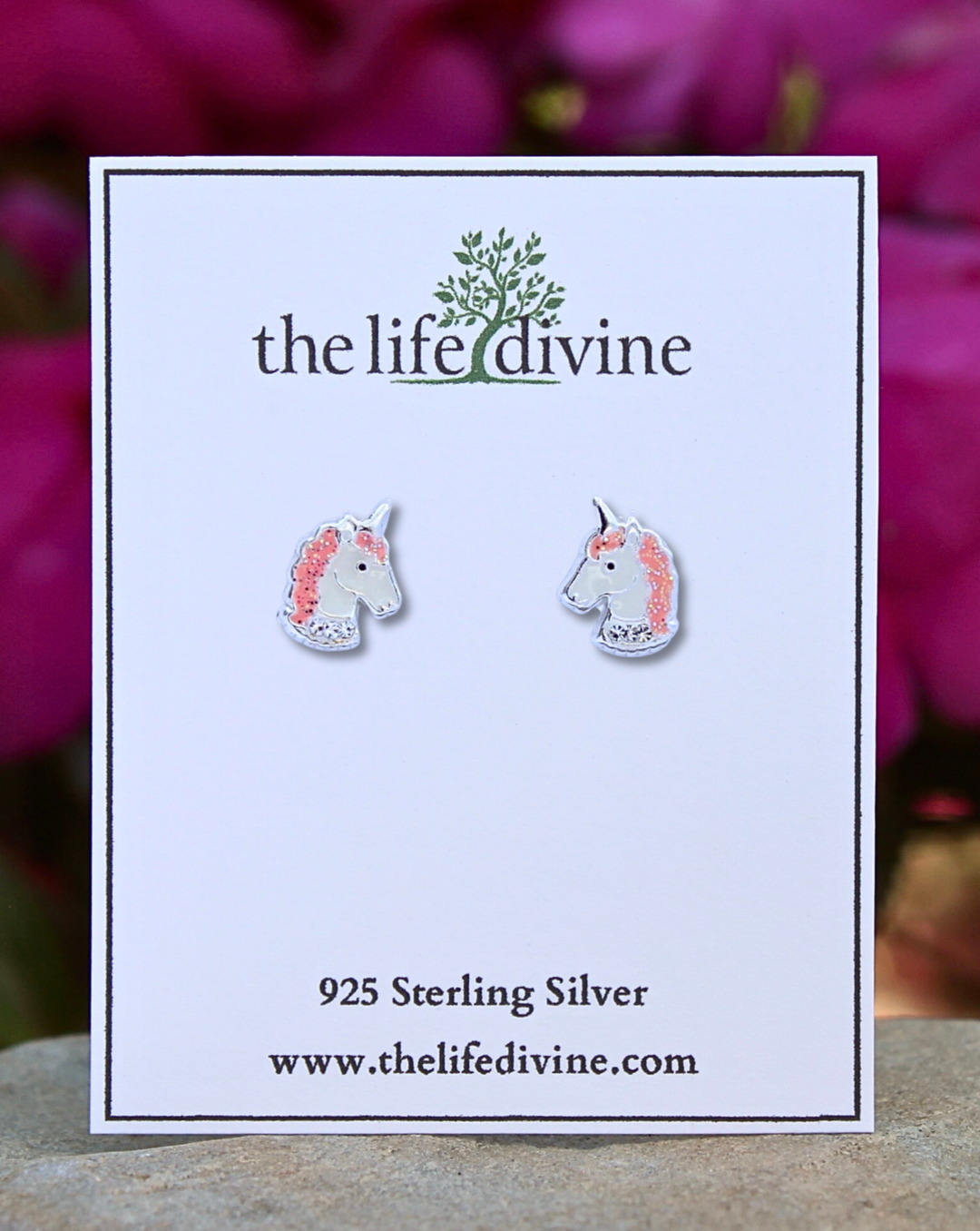 Unicorn Sterling Silver Earrings on a card.