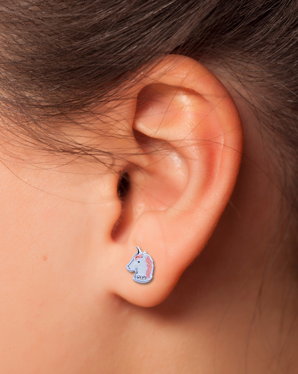 Unicorn Sterling Silver Stud Earring on an ear.