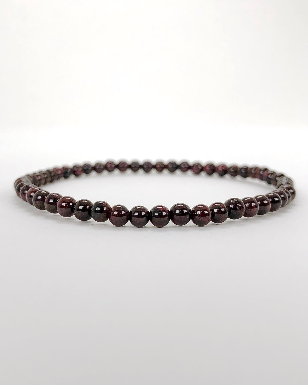 Garnet 4mm Beaded Gemstone Bracelet on white background