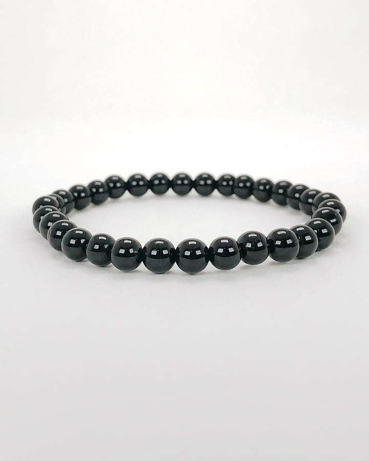 Black Agate 6mm Beaded Gemstone Bracelet on a white background.