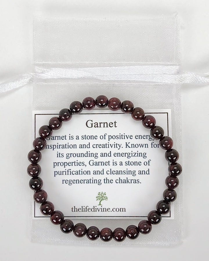 Garnet 6mm Beaded Gemstone Bracelet with a description card.