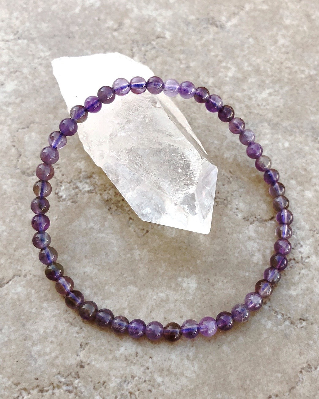 Amethyst 4mm Beaded Bracelet  on a Crystal.