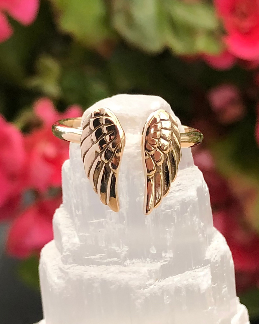 Angel Wings Adjustable Bronze Ring on selenite