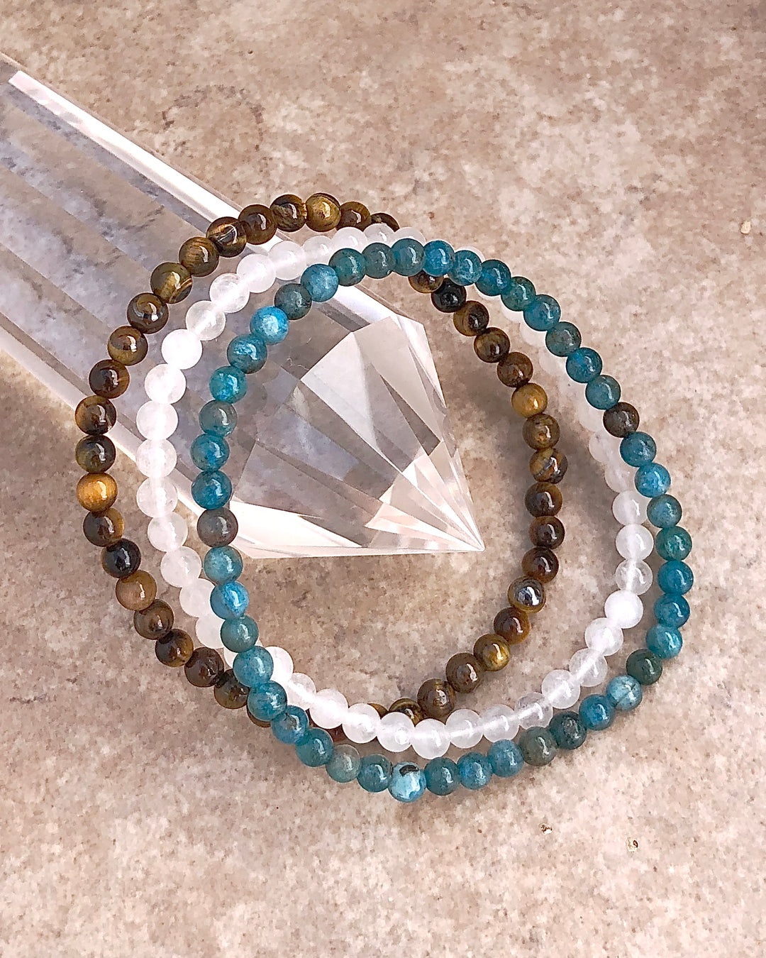 Courage and Truth 4mm Gemstone Bracelet Set  with Apatite, Snow Quartz and Tiger Eye on a crystal