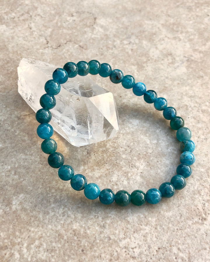 Apatite 6mm Beaded Gemstone Bracelet on a crystal