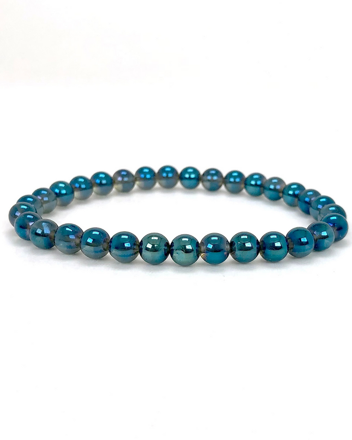 Aqua Aura 6mm beaded Gemstone Bracelet on a white background.