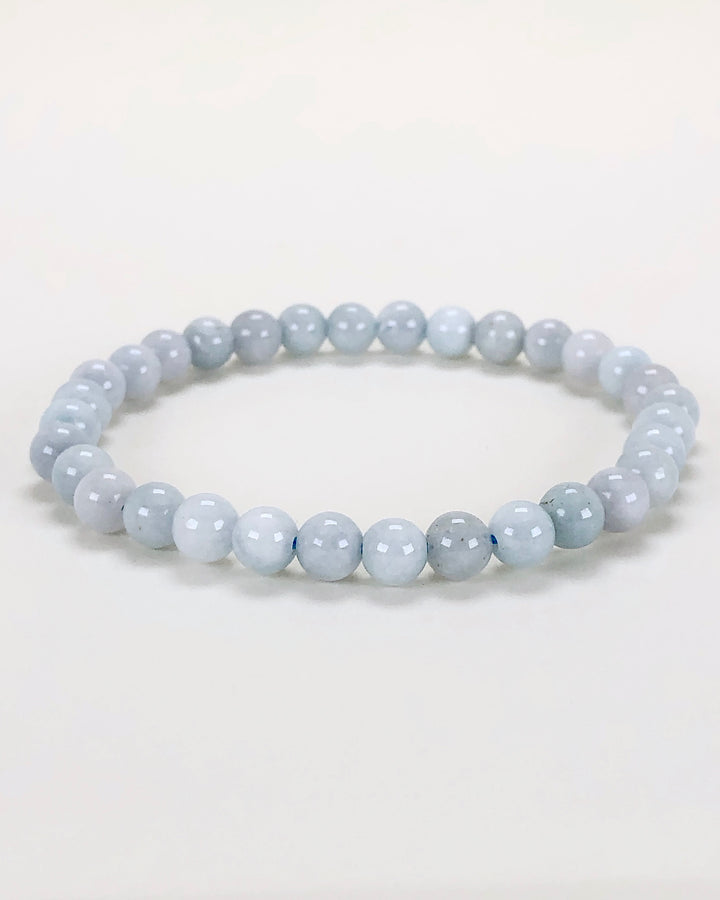 Aquamarine 6mm Beaded Gemstone Bracelet on a white background.