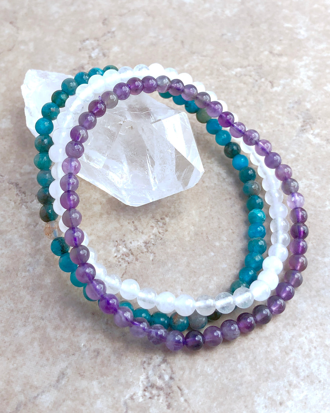 Amethyst, Snow Quartz and Apatite 4mm beaded Bracelet Set for Balance and Clarity on a Crystal.