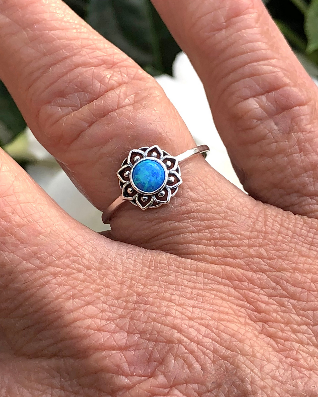 Blue Lab Opal Lotus Flower Ring on finger