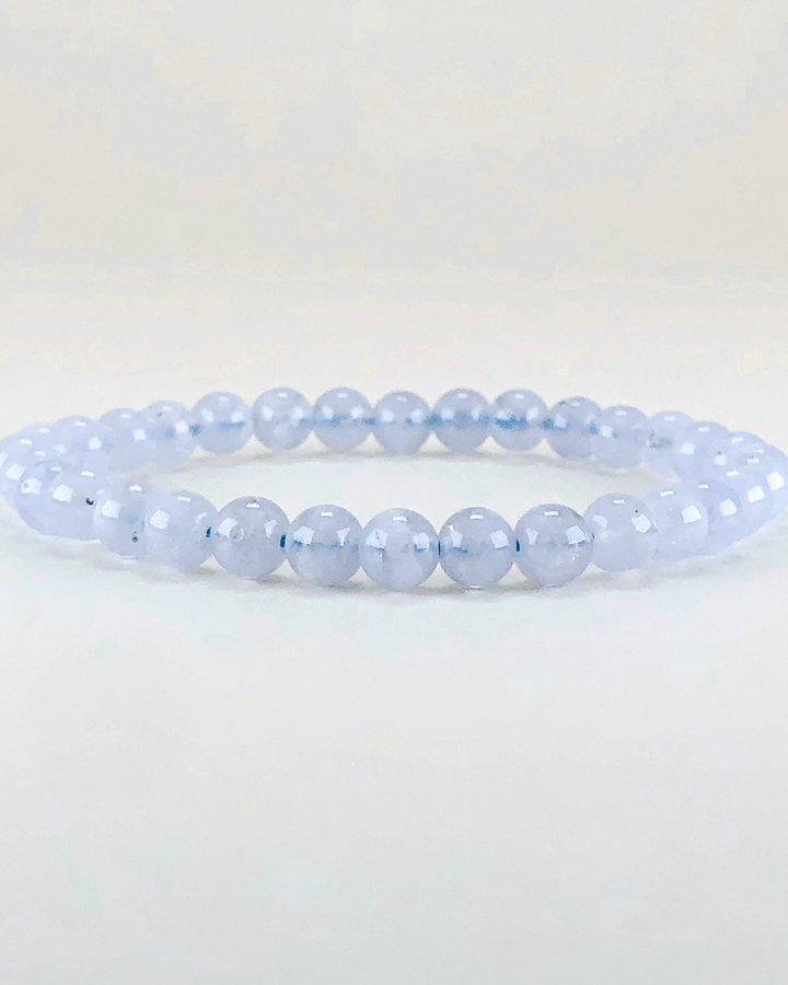 Blue Lace Agate 6mm Beaded Gemstone Bracelet on a white background.