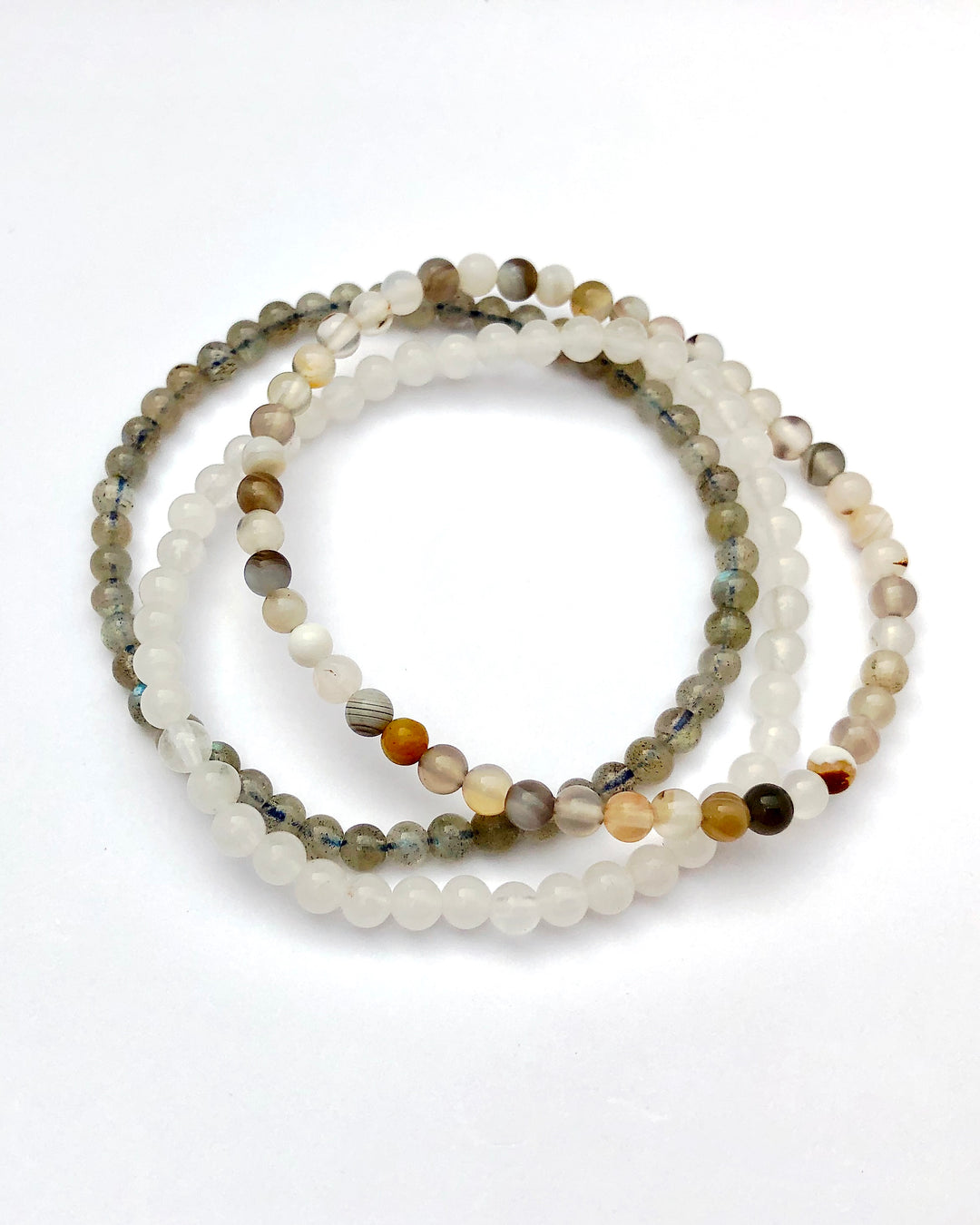Inner Strength 4mm Beaded Gemstone Bracelet Set with Botswana Agate, Snow Quartz and Labradorite on a white background