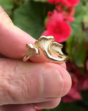 Bronze Chanterelle mushroom ring held between two fingers