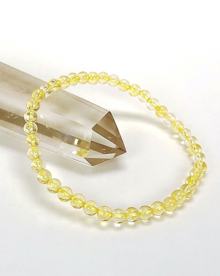 Citrine 4mm Gemstone Bracelet on a crystal