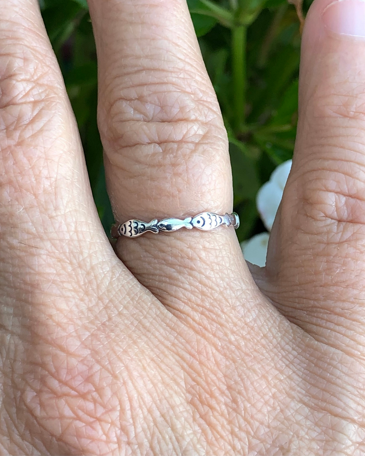 Sterling Silver Fish Ring on ring finger close up