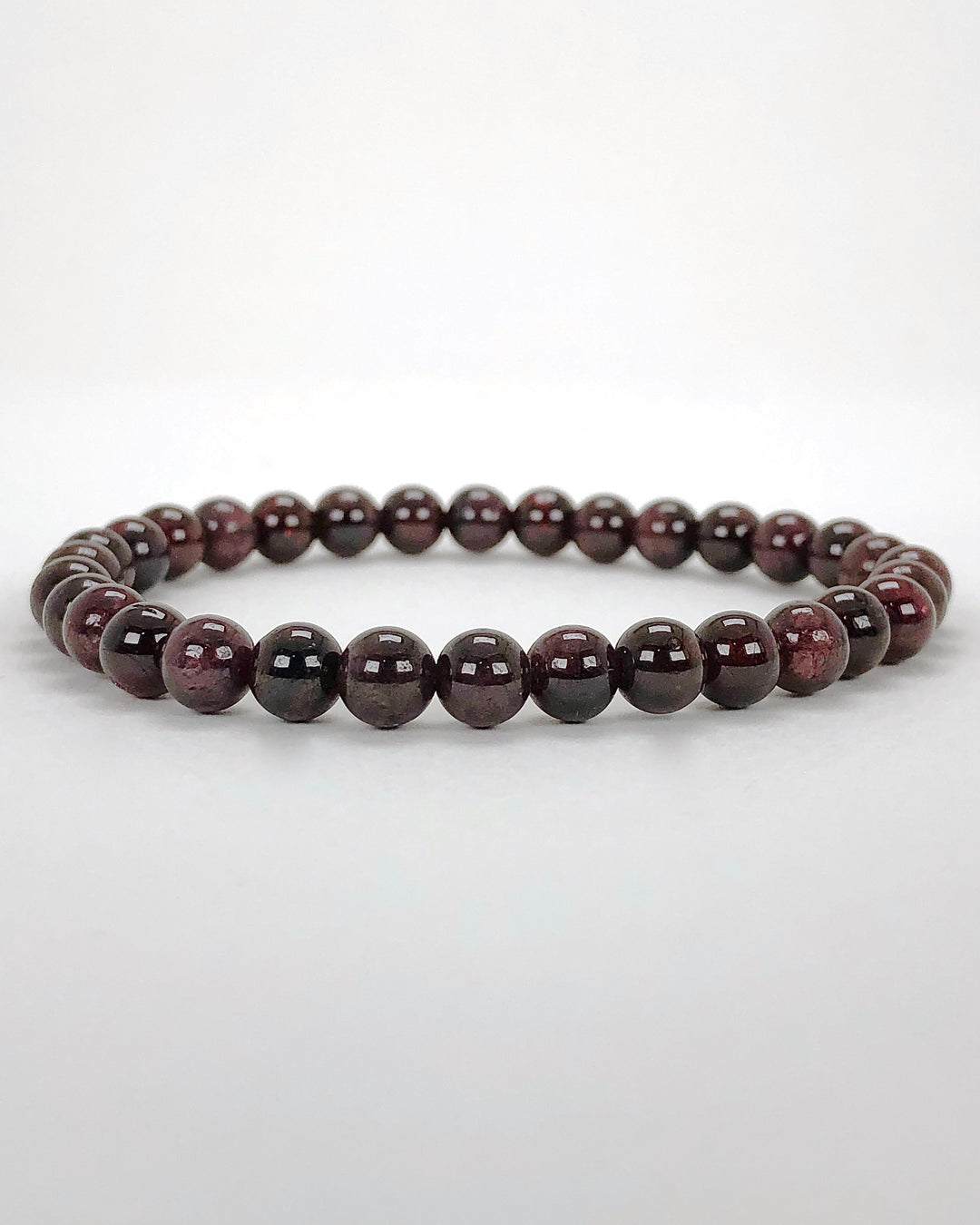 Garnet 6mm Beaded Gemstone Bracelet on a white background.