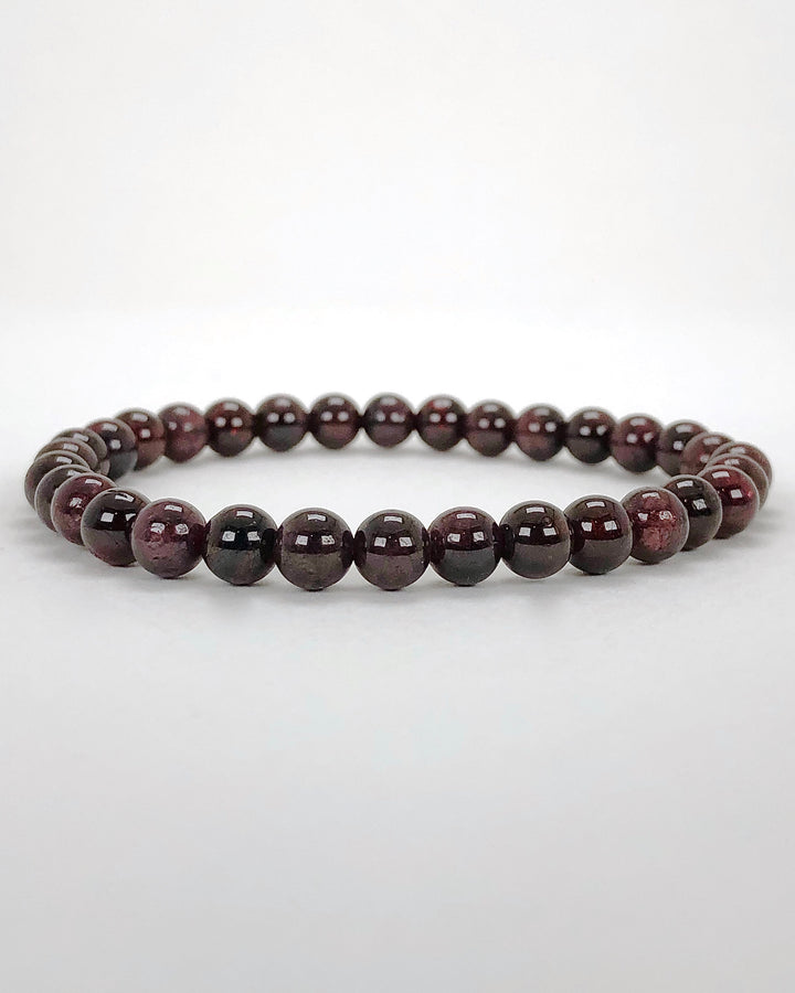 Garnet 6mm Beaded Gemstone Bracelet on a white background.