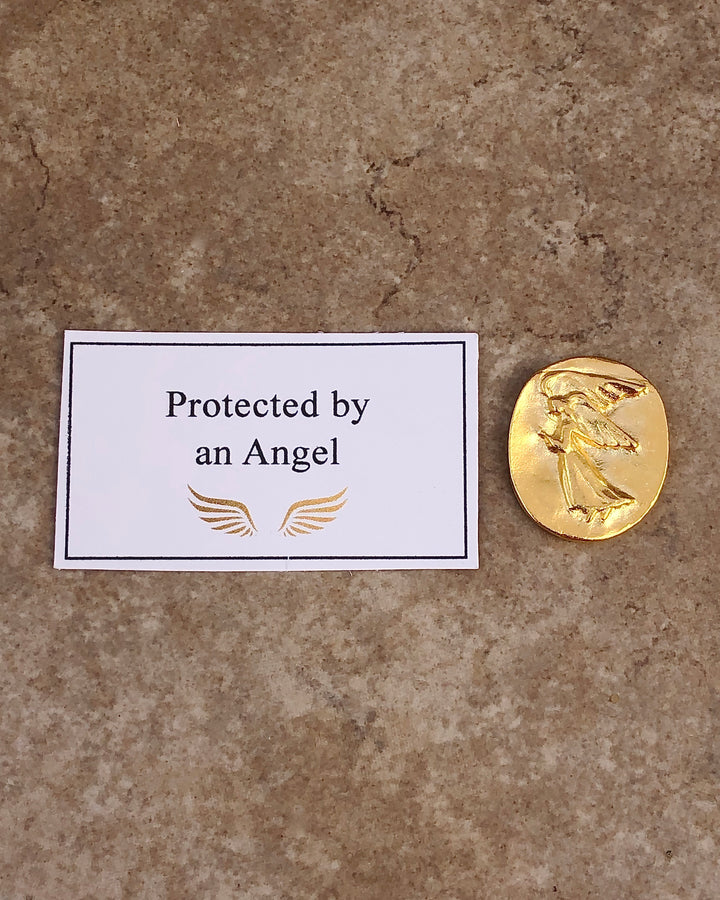 Gold pocket angel with a protected by an angel card