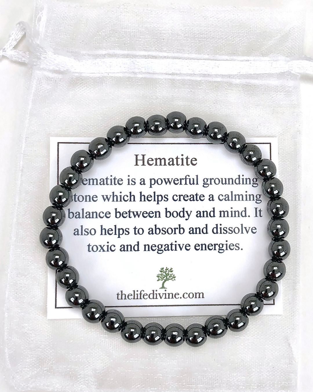 Hematite 6mm Beaded Gemstone Bracelet with a description card.