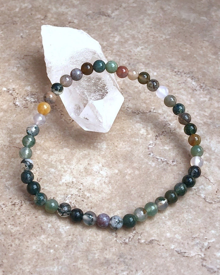 Indian Agate 4mm Beaded Gemstone Bracelet on a crystal