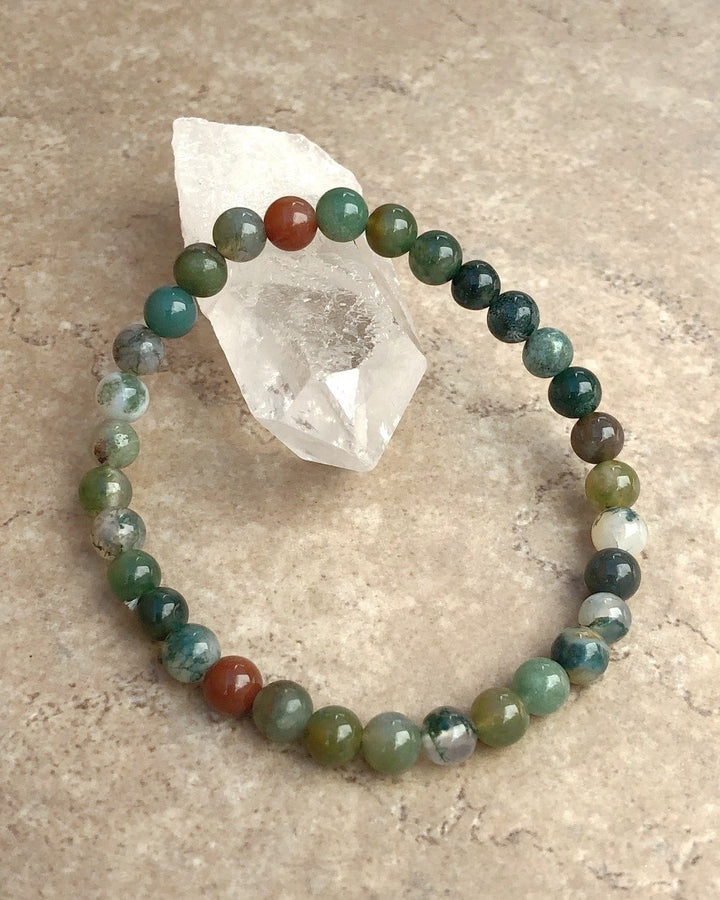 Indian Agate 6mm Beaded Gemstone Bracelet on a crystal.