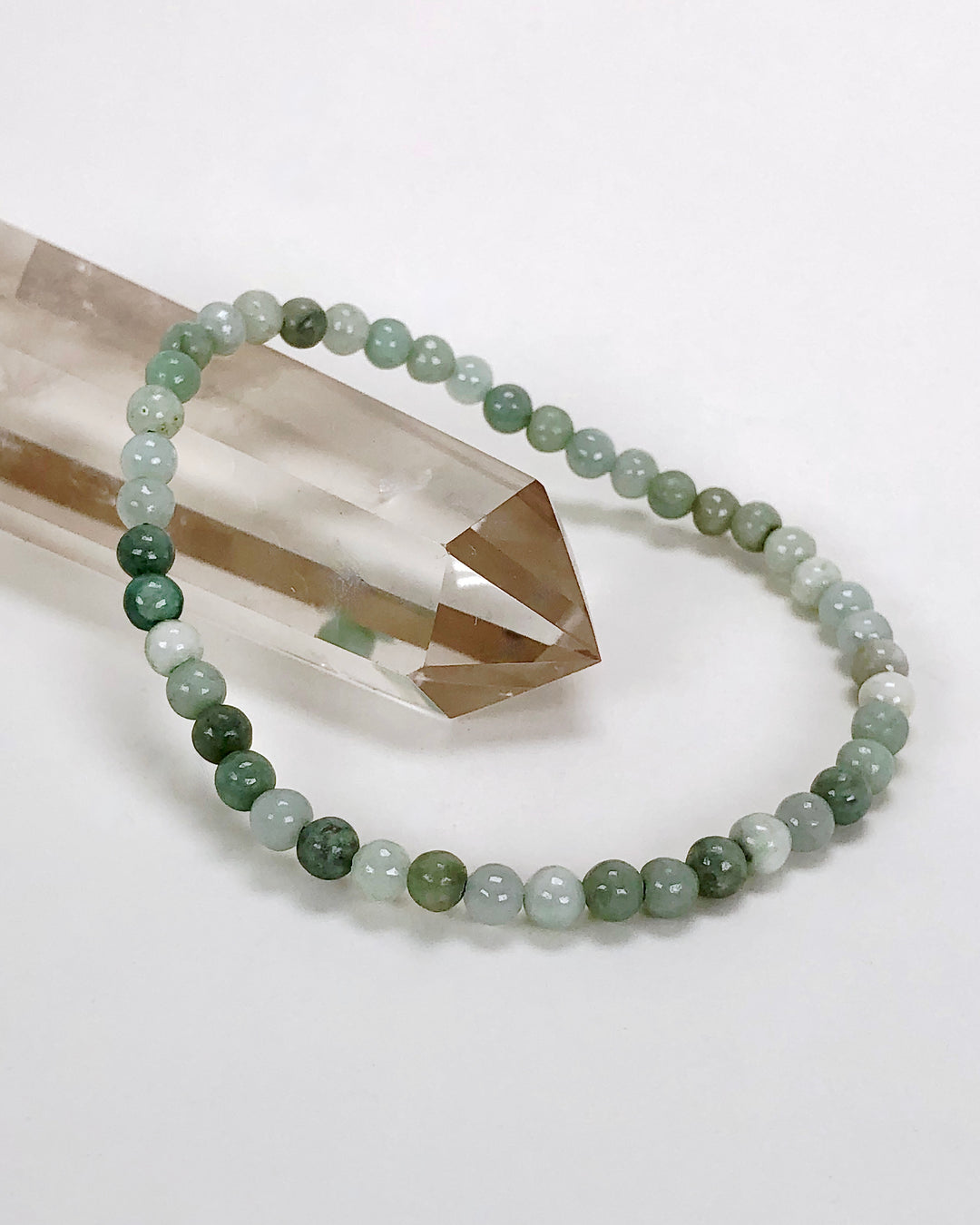 Jadeite 4mm Beaded Gemstone Bracelet on a crysta.