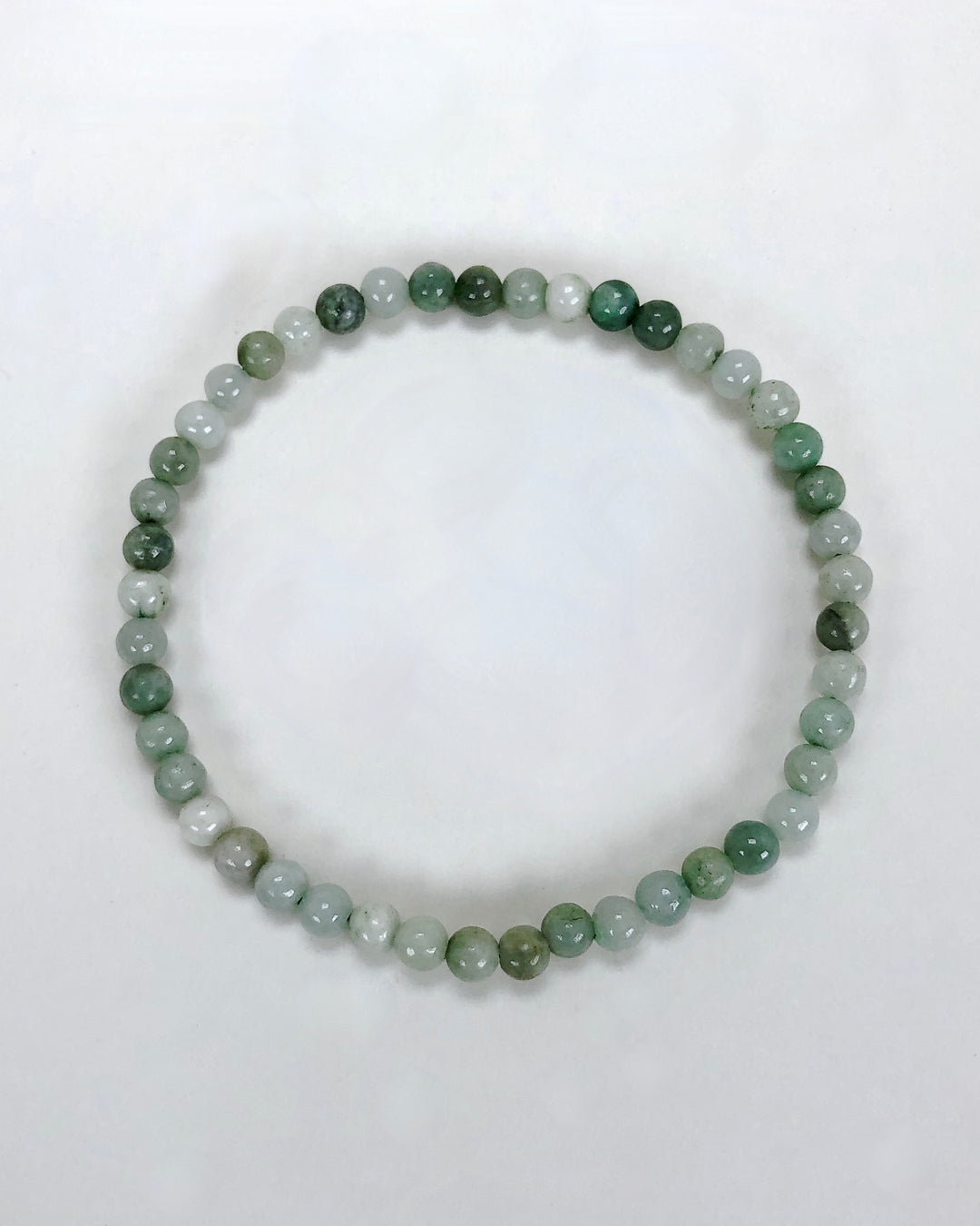 Jadeite 4mm Gemstone Bracelet on a white background.