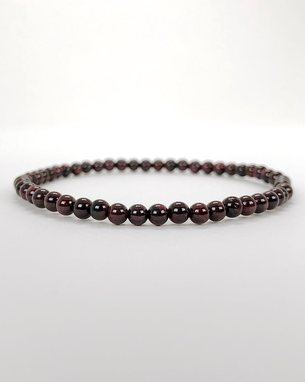 Children's Garnet 4mm Gemstone Bracelet on a white background