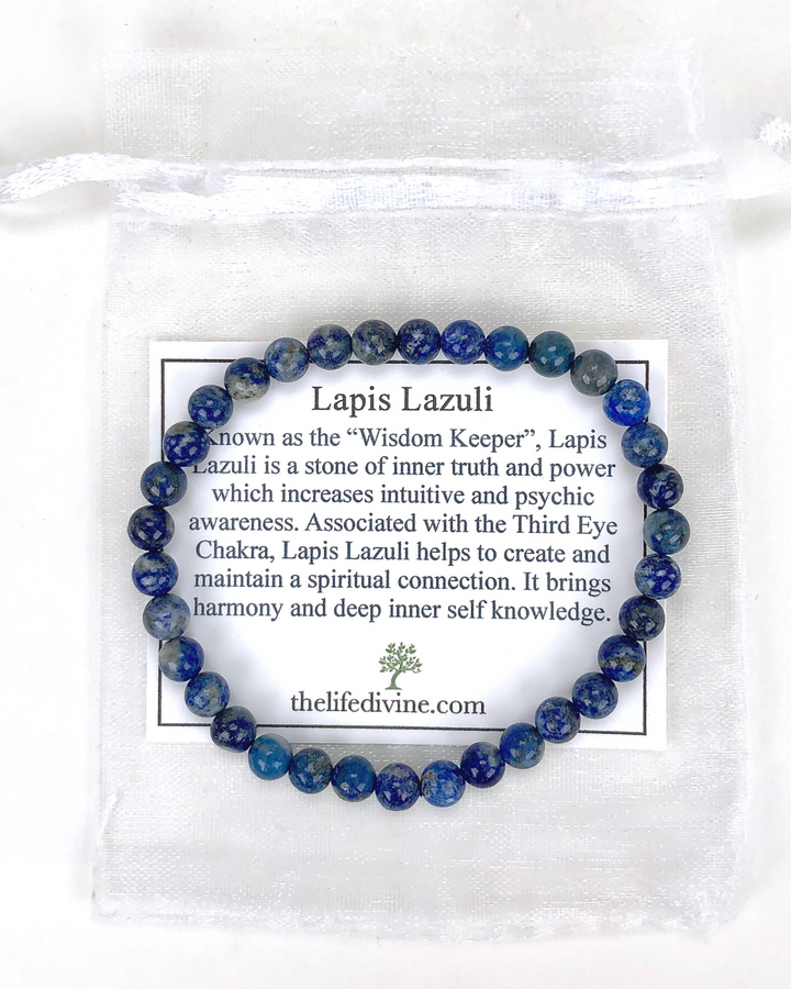 Lapis Lazuli 6mm Beaded Gemstone Bracelet with a description card.