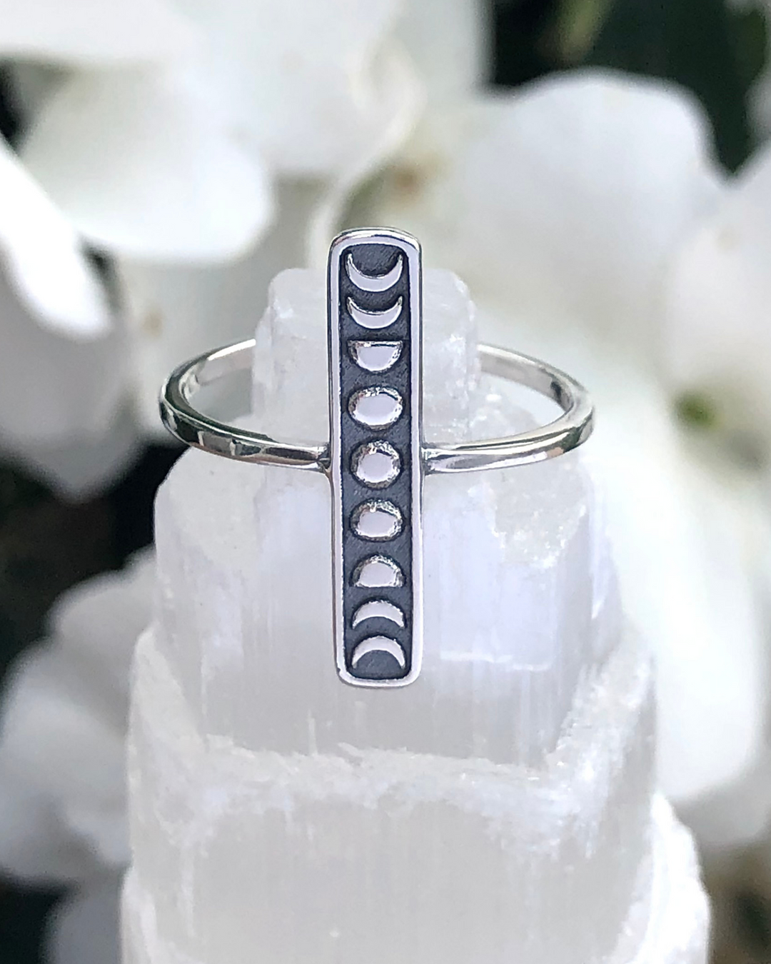 Moon Phases Bar Design Sterling Silver Ring on a crystal