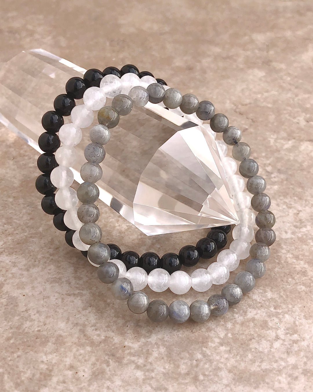 Amethyst, Snow Quartz and Labradorite 6mm beaded Gemstone Bracelet Set for Peaceful Transformation on a crystal.