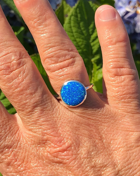 Sterling Silver round lab opal ring on finger
